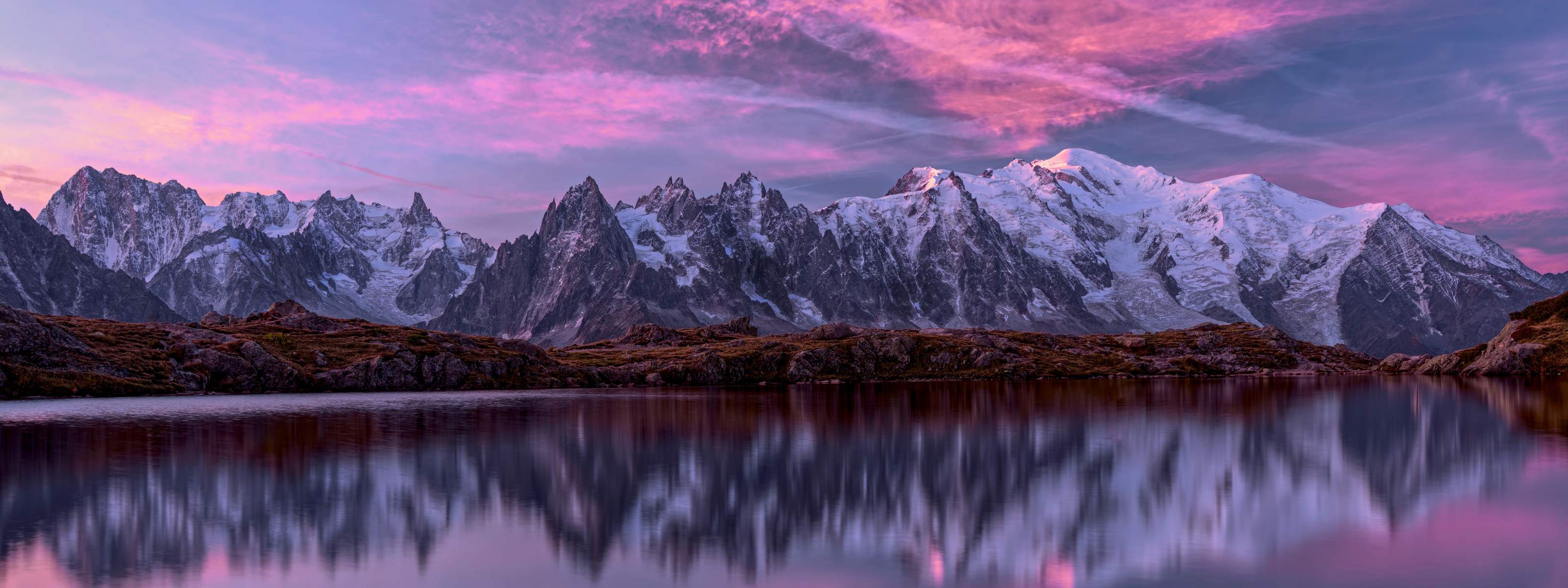 Snowy mountains reflecting in a lake. 